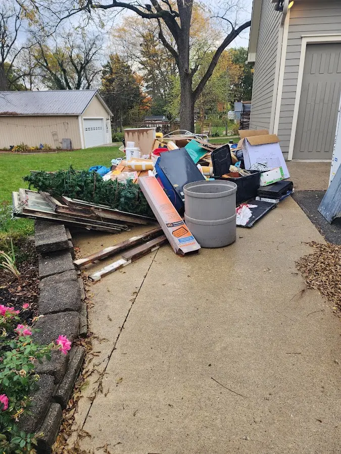 Dumpster being loaded with debris for 30 Yard Dumpster Rental in Mount Arlington